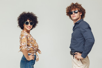 Young retro loving couple posing isolated