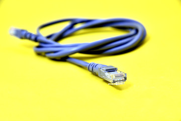 Cable network connection isolated on a white background. An Ethernet RJ45 cable