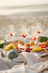 Group of friends enjoying  with champagne at the Beach