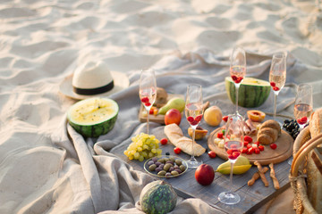 Group of friends enjoying  with champagne at the Beach