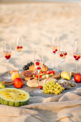 Group of friends enjoying  with champagne at the Beach