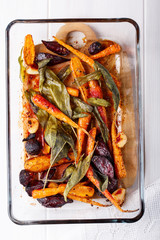 Oven baked carrots and beetroots with sage leaves and garlic.