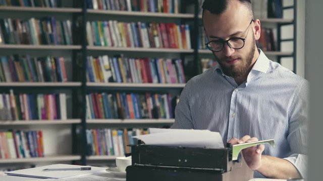 Young author typing on a retro typewriter