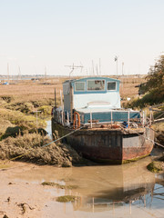 parked moored big boat in dock marshland front view