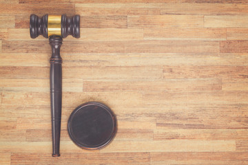 Wooden Law Gavel, copy space on wooden table, retro toned