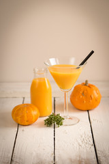 display wooden table halloween martini cocktail mixed drink orange colour autumn festive time