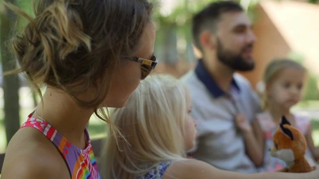 Close up family have lunch at terrace baby talking with mom rapid slow motion