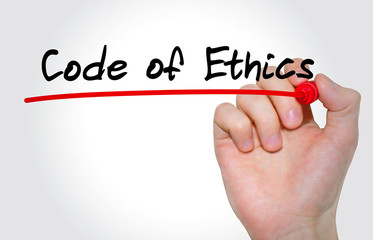Hand writing inscription code of ethics with marker, concept