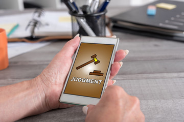 Judgment concept on a smartphone