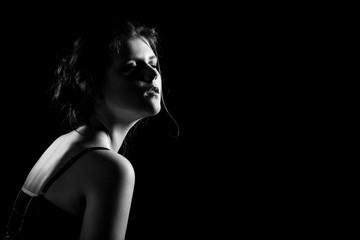 Naklejka premium sensual dreaming woman in enjoyment on black background with copy space, monochrome