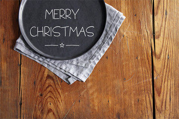 merry christmas plate on wooden table
