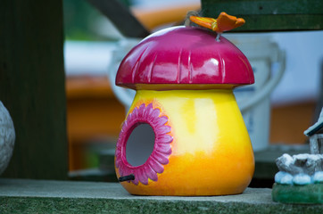 Close-Up of Colorful Birdhouse in Garden