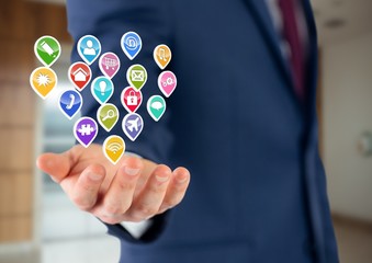 businessman with hand spread of  with application icons over.