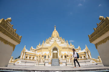 Fototapeta premium 15 December 2016 Female tourist walking at Swe Taw Myat, Buddha Tooth Relic Pagoda a famous and beautiful buddhist temple in yangon , myanmar