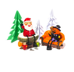 Pumpkin toy doss sitting on orange sofa and Santa   sitting on the table waiting for happy time in Christmas tree wood