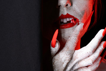 Scary peering halloween vampire with copy space