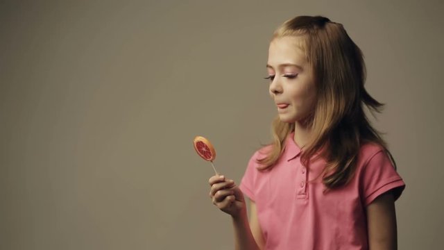 Girl with lollipop candy