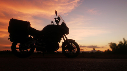 Fototapeta na wymiar motorcycle Big bike adventure Silhouette evening In tropical countries summer