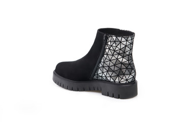 Black suede boot isolated on white background.