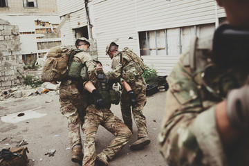 Fototapeta premium special forces soldiers with weapons during the rescue operation. war, army, technology and people concept.