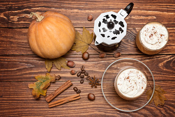 Fresh pumpkin latte, smoothie on wooden rustic background, topview