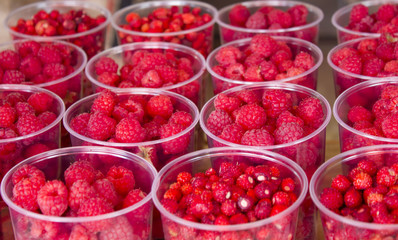 glasses with raspberries on the table