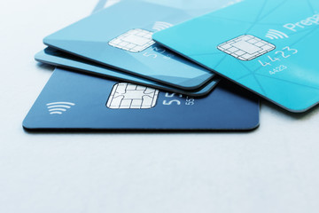 Multiple credit cards on a light background. Selective focus. Concept - Finance, business, cashless payment.