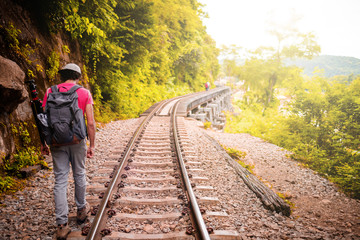 Man traveler traveling walking with backpack at the jungle on holiday at weekend on background nature view