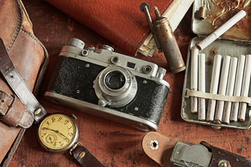 Retro camera surrounded by Antiques