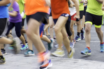 City runners ,blurred sport background