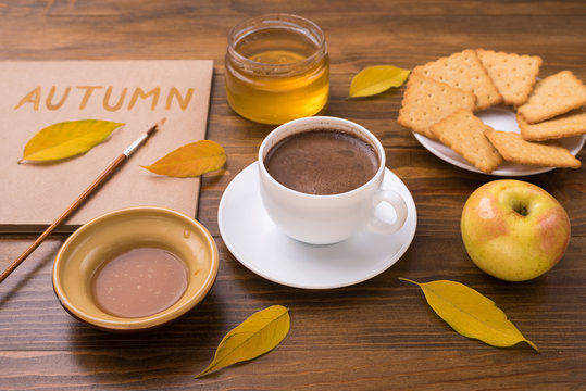 Autumn composition with coffee and leaves