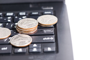 The group of Thai coins on laptop, business concept