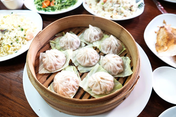 Xiaolongbao with cabbage on basket