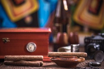Wooden humidor, cigars and ashtray - obrazy, fototapety, plakaty