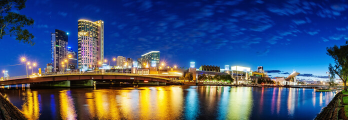 A beautiful view of Melbourne downtown across the Yarra river at night in Melbourne, Victoria, Australia.