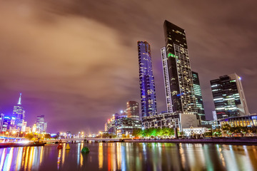 A view across the Yarra river at the landmark of Melbourne downtown during the city’s nightime..