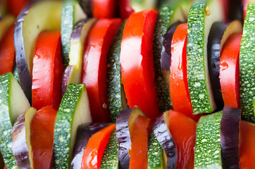 Vegetables sliced for baking in the oven. Homemade ratatouille in the protvin.