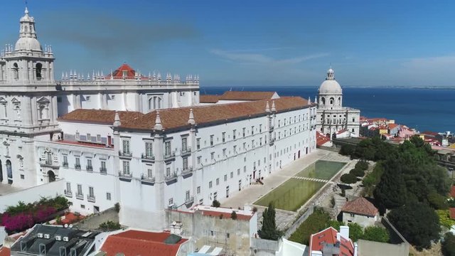 Aerial view of Church or Monastery of Sao Vicente de Fora in Portuguese Igreja da Sao Vicente de Fora a 17th-century church and monastery in the city of Lisbon Portugal flying backwards slowly 4k