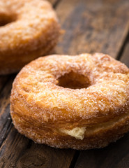 donuts with sugar on wood