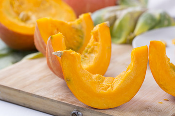 Closeup of pumpkin slices on the table.