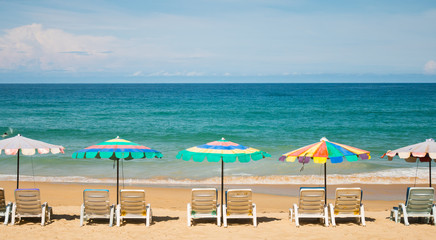 Group of Beach umbrella on the  beautiful beach with blue sky in summer season in travel and holiday concept.