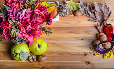 Fototapeta na wymiar Autumn concept with fruits, flowers and nuts 