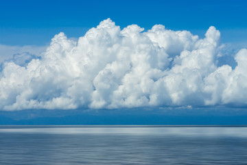 White cloud over the lake with blue sky.