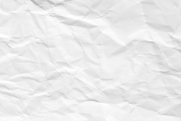The texture of white paper with dents and kinks. Background of the rumpled surface.