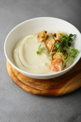 Vegetables Cream-soup with salmon in bowl