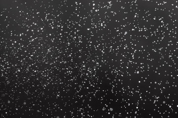abstract black and white bokeh from water spray for christmas and happy new years celebration background.