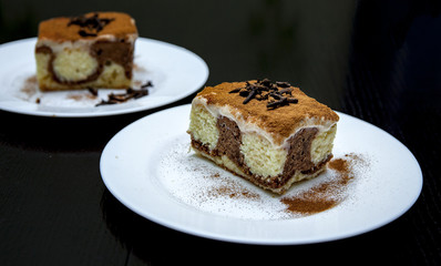 piece of cake on a plate on a dark background