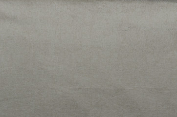 A background or texture of beige linen or cotton material