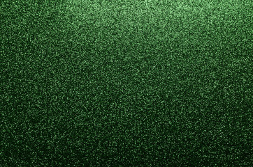 Green glittering background suitable for a festive scene