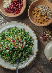 A gourmet salad on rustic surface, vertical, top view